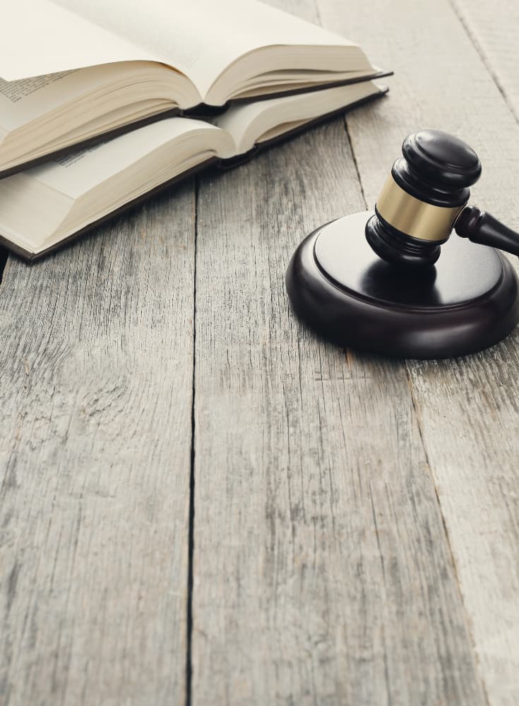 court hammer with opened books | Netsheria International Legal services in Kenya